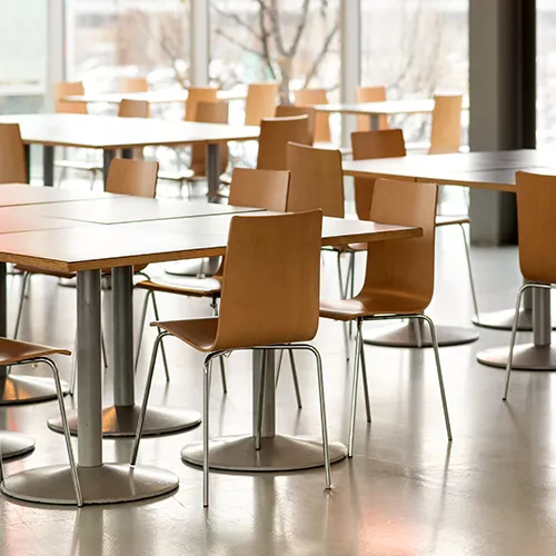 A dining hall set for a corporate lunch